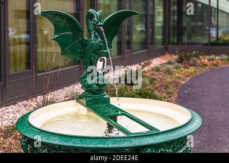 Basilisk drinking water fountain in Basel, Switzerland. The figure on the Basilisk drinking fountain in Basel also plays a role in the Harry Potter tale in the Chamber of Secrets Stock Photo