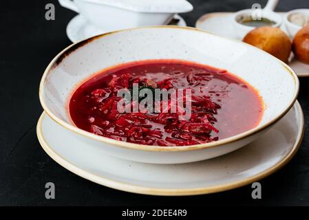 beetroot Russian soup on a textured black background Stock Photo