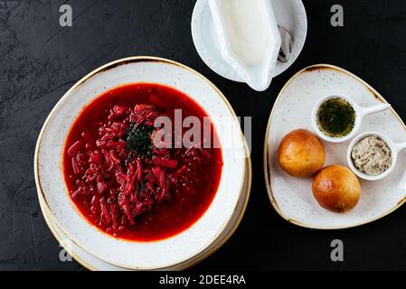 beetroot Russian soup on a textured black background Stock Photo