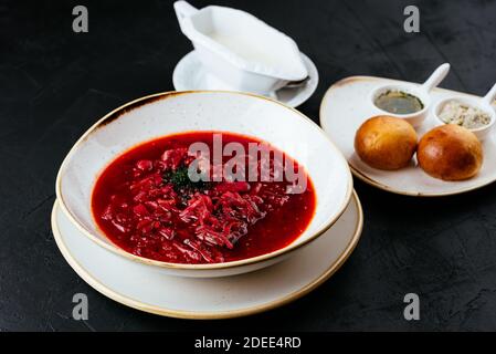 beetroot Russian soup on a textured black background Stock Photo