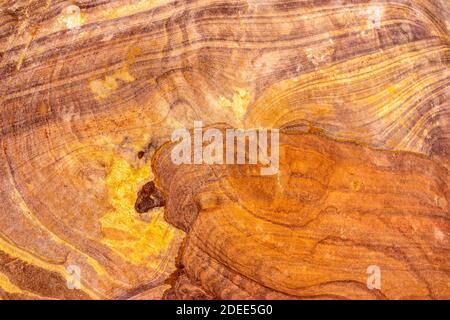 Spectacular layers of multi-coloured sandstone rock surrounding the 'lost city' of Petra in Jordan Stock Photo