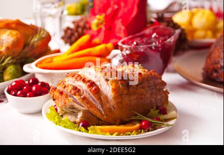 Traditional sliced honey glazed ham for festive Christmas or Thanksgiving table. Stock Photo