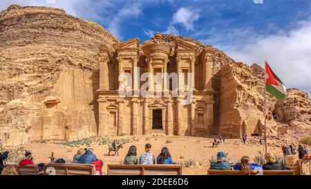 PETRA, JORDAN - January 13  2020: Nabatean ancient city of Petra. Facade of the Ad Deir The Monastery with tourists Temple In Petra In Jordan Stock Photo