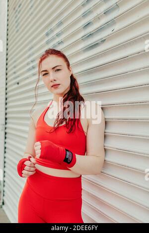 Portrait of a young woman boxer training outdoors in Brooklyn street. Stock Photo