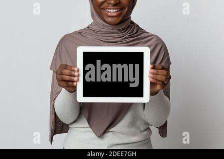 Download Unrecognizable Afro Woman In Hijab Pointing At Smartphone With Black Screen Stock Photo Alamy