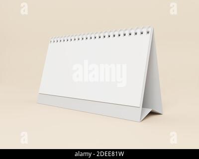 Blank desk calendar on a beige background. Stock Photo