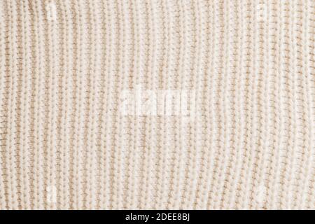 Woolen knitted patterned fabric with folds background texture textile Stock Photo