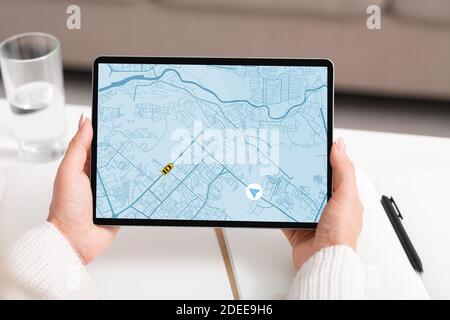 Taxi Service App. Woman Holding Digital Tablet, Tracking Cab Geolocation On Map Stock Photo
