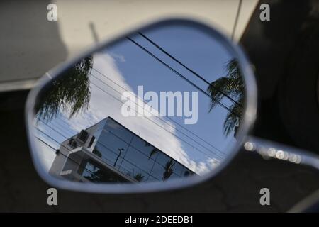 Rear view mirror, motorcycle in zoom photo, with reflection of building in the background, selective focus, blurred background, Brazil, South America Stock Photo