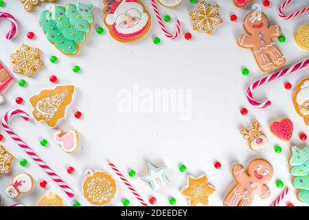 Christmas sweets set. Assorted festive Christmas and New Year sweets, traditional candy and cookie. Flatlay with candy cane candies, gingerbread, swee Stock Photo