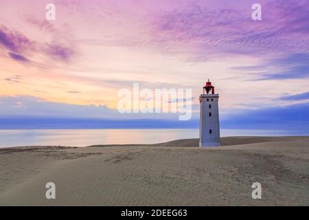 Rubjerg Knude Fyr / Rubjerg Knude lighthouse on the top of Lønstrup Klint in evening light, Hjørring, North Jutland, Denmark Stock Photo