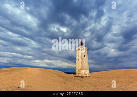 Rubjerg Knude Fyr / Rubjerg Knude lighthouse on the top of Lønstrup Klint in evening light, Hjørring, North Jutland, Denmark Stock Photo