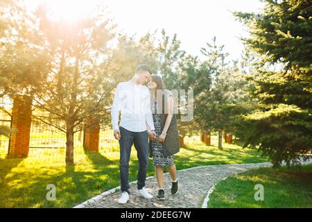 young, happy, loving couple, walking in the Park, and enjoy each other, advertising Stock Photo