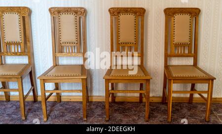 Vintage Wooden Classical Carved Chair Upholstered in a Beautiful Cloth. Retro Style. Furniture for Refined Interior. Old, Palace Furniture. Stock Photo