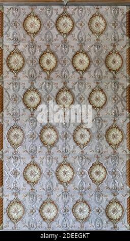 Antique Old Fashioned Tiled Stove. Textures, Backgrounds  Ceramic Tile on the Stove for Heating. Stock Photo