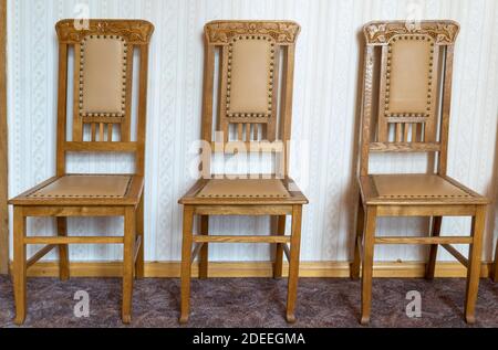 Vintage Wooden Classical Carved Chair Upholstered in a Beautiful Cloth. Retro Style. Furniture for Refined Interior. Old, Palace Furniture. Stock Photo