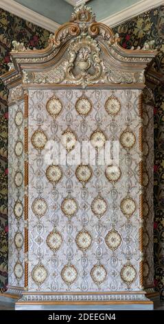 Antique Old Fashioned Tiled Stove. Textures, Backgrounds  Ceramic Tile on the Stove for Heating. Stock Photo