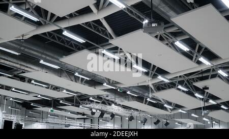 Factory building or warehouse building. Vast empty space with ventilation pipes and lights Stock Photo