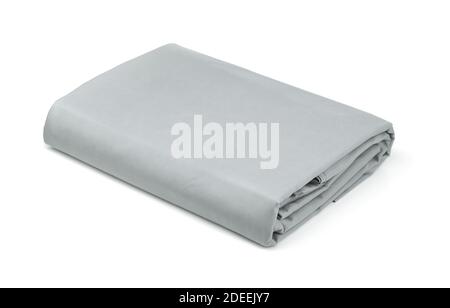 Folded grey cotton bedding sheets isolated on white Stock Photo