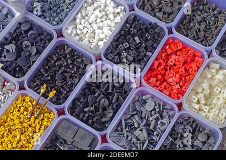 Various small plastic car parts for interior in box Stock Photo
