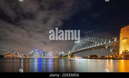 Sydney, New South Wales, Australia ; Sydney skyline and Opera House illuminated at night. Stock Photo