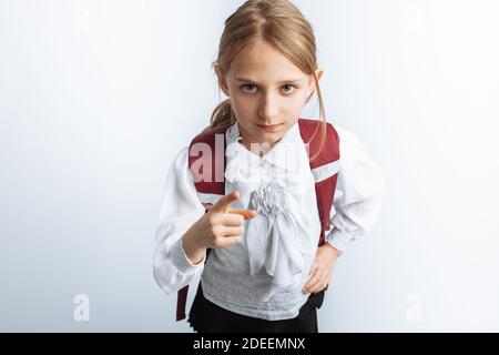 little beautiful schoolgirl girl, with briefcase, white background, advertising Stock Photo