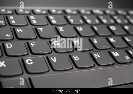Close up of black gray laptop keyboard - diminishing perspective Stock Photo