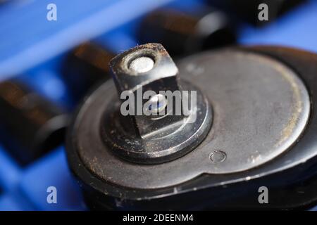 Macro close up of reversibel ratchet wrench head on socket set box Stock Photo