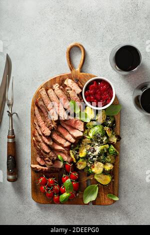 Steak board with brussel sprouts Stock Photo