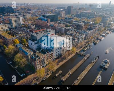 Amsterdam, The Netherlands, 7th November 2020 Aerial view of tCarre theather in Amsterdam And the river Amstel, City hall and Hermitage autumn Stock Photo