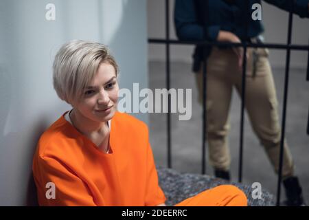 Portrait of a young prisoner in a uniform in a prison cell. Stock Photo