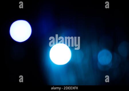 An abstract background image of glowing lights in the dark. Stock Photo