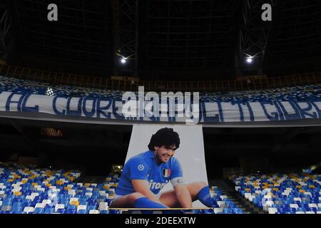 Napoli, Italy. 29th Nov, 2020. A giant portrait of Diego Armando Maradona is seen on the stands prior to the Serie A football match between SSC Napoli and AS Roma at San Paolo stadium in Naples (Italy), November 29th 2020. SSC Napoli team played the match with a special shirt dedicated to Diego Armando Maradona died on november 25th at age of 60. Credit: insidefoto srl/Alamy Live News Stock Photo