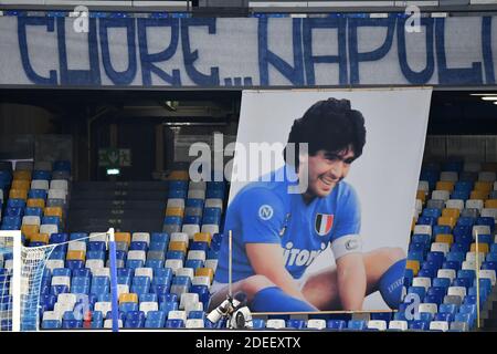 Napoli, Italy. 29th Nov, 2020. A giant portrait of Diego Armando Maradona is seen on the stands prior to the Serie A football match between SSC Napoli and AS Roma at San Paolo stadium in Naples (Italy), November 29th 2020. SSC Napoli team played the match with a special shirt dedicated to Diego Armando Maradona died on november 25th at age of 60. Credit: insidefoto srl/Alamy Live News Stock Photo