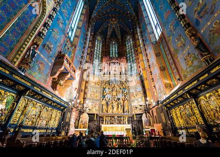 Nave, choir and altar with altarpiece. Saint Mary’s Basilica. Cracow, Kraków County, Lesser Poland Voivodeship, Poland, Europe Stock Photo