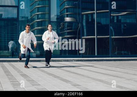 in full growth. medical professionals running to the rescue. Stock Photo