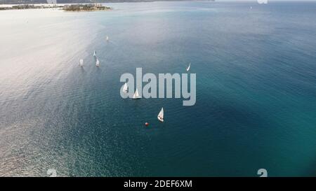 A group of boats cruising along the northern coastline of Montego Bay Jamaica; located within the Caribbean Sea. Pristine and beautiful waters. Stock Photo