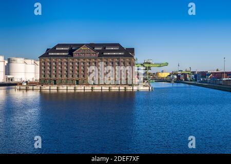 Berlin, Germany - November 7, 2020: Westhafen port BEHALA, inland port and operator of the trimodal freight hub with the building of the Customs bonde Stock Photo