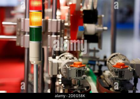 Industrial tower signal lights indicate the error status of the production line. Selective focus. Stock Photo