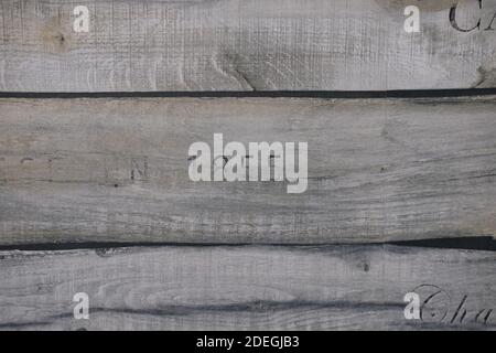 wooden texture of three planks with number 1855 embrassed on it Stock Photo