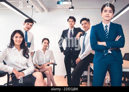 Group portrait of smiling diverse young businesspeople posing together in modern office Stock Photo