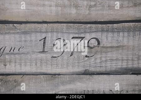 wooden texture of three planks with number 1979 embrassed on it Stock Photo