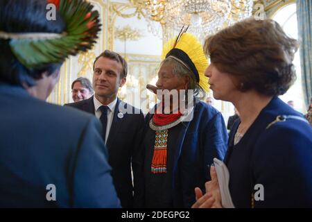 French president Emmanuel Macron receives Brazil's legendary indigenous chief Raoni Metuktire at the Elysee Palace, in Paris, France. The elderly Kayapo chief, internationally recognisable through his traditional lip plate and feather headdress, will seek to raise one million euros (1,1 million USD) to better protect the Amazon's Xingu reserve, home to many of Brazil's tribal peoples, from loggers, farmers and fire. Photo by pool/ABACAPRESS.COM Stock Photo