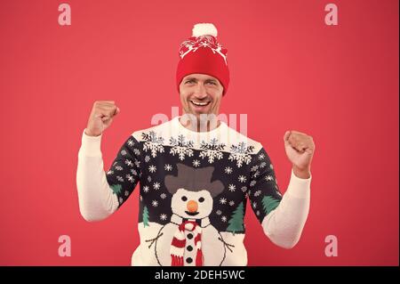 Winter chill get strong. Unshaven guy smile in snowman winter style jumper. Happy man with casual winter look. Warm knitted design for cold weather. Keeping warm and festive during winter holidays. Stock Photo