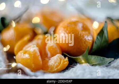 Christmas concept with tangerines and bokeh lights Stock Photo