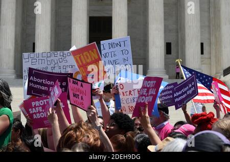 Pro-abortion activists hold placards during a rally at the Supreme Court in reaction to the passage of bills in Alabama, Georgia, Missouri and other states that restrict access to abortion on May 21, 2019 in Washington, DC. Photo by Olivier Douliery/ABACAPRESS.COM Stock Photo