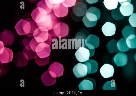 Pink and cyan modern bokeh lights. Urban defocused backdrop for inserting text Stock Photo
