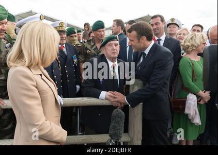 Brigitte Macron, Leon Gautier and Emmanuel Macron attending a ceremony to pay homage to the Kieffer commando on June 6, 2019 in Colleville-Montgomery, Normandy. The Kieffer commando, an elite French unit, was among the first waves of Allied troops to storm the heavily defended beaches of Nazi-occupied northern France, beginning the liberation of western Europe. Photo by Jacques Witt/Pool/ABACAPRESS.COM Stock Photo