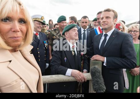 Brigitte Macron, Leon Gautier and Emmanuel Macron attending a ceremony to pay homage to the Kieffer commando on June 6, 2019 in Colleville-Montgomery, Normandy. The Kieffer commando, an elite French unit, was among the first waves of Allied troops to storm the heavily defended beaches of Nazi-occupied northern France, beginning the liberation of western Europe. Photo by Jacques Witt/Pool/ABACAPRESS.COM Stock Photo