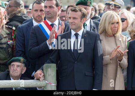 Leon Gautier, Emmanuel and Brigitte Macron attending a ceremony to pay homage to the Kieffer commando on June 6, 2019 in Colleville-Montgomery, Normandy. The Kieffer commando, an elite French unit, was among the first waves of Allied troops to storm the heavily defended beaches of Nazi-occupied northern France, beginning the liberation of western Europe. Photo by Jacques Witt/Pool/ABACAPRESS.COM Stock Photo